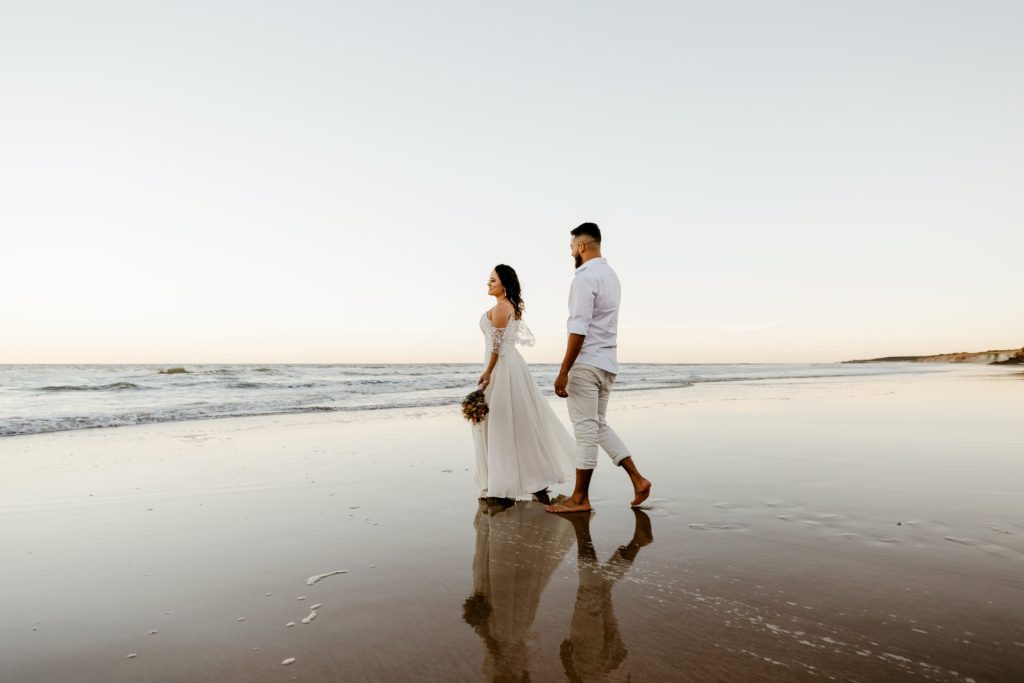 Newlyweds on beach